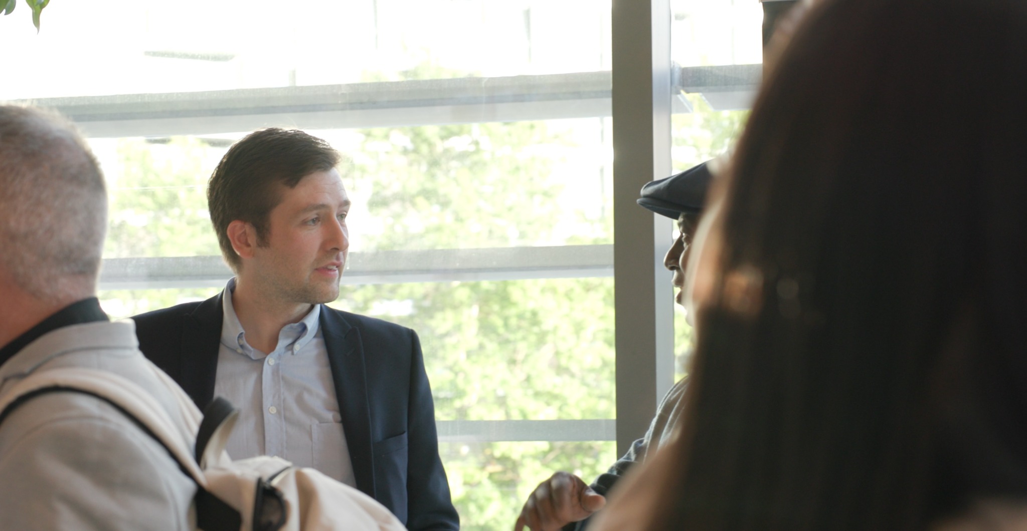 A member of the Swift team in conversation with visitors at a property event